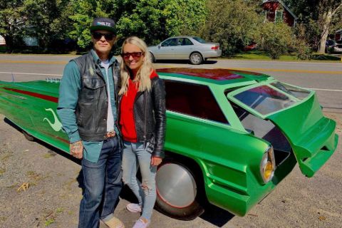 Chad Hiltz and his wife Jolene MacIntyre pose infront of a custom car.